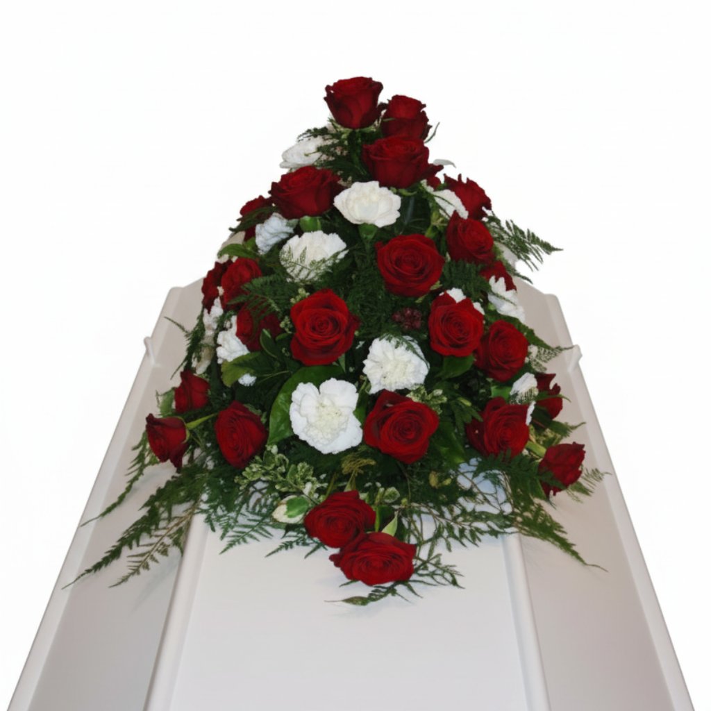 Kistepynt med nelliker og roser